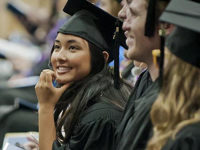 new graduate smiling during ceremony